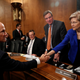 Richard Smith, former chairman and CEO of Equifax, Inc., greets Sen. Elizabeth Warren (D-MA) prior to testifying before the U.S. Senate Banking Committee on Capitol Hill in Washington, U.S., October 4, 2017. REUTERS/Aaron P. Bernstein - RC1DB1A00A20